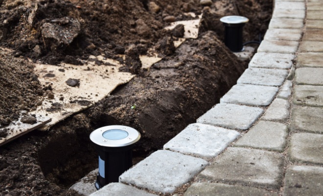 solar garden lights being installed