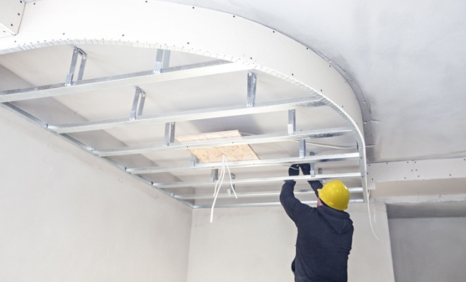 man installing suspended ceiling