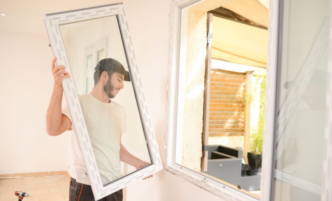 person replacing windows